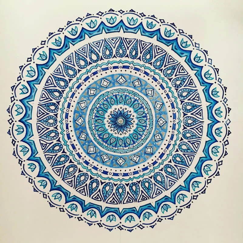 hand drawn pen and ink mandala with lotus flowers