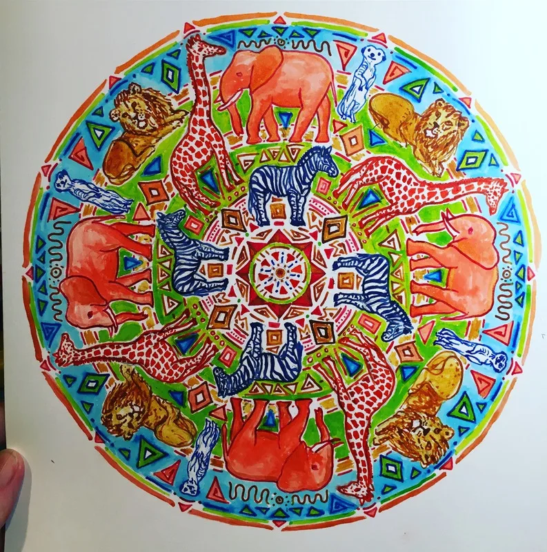 hand drawn pen and ink mandala with zebras, elephants, giraffes, lions, meerkats