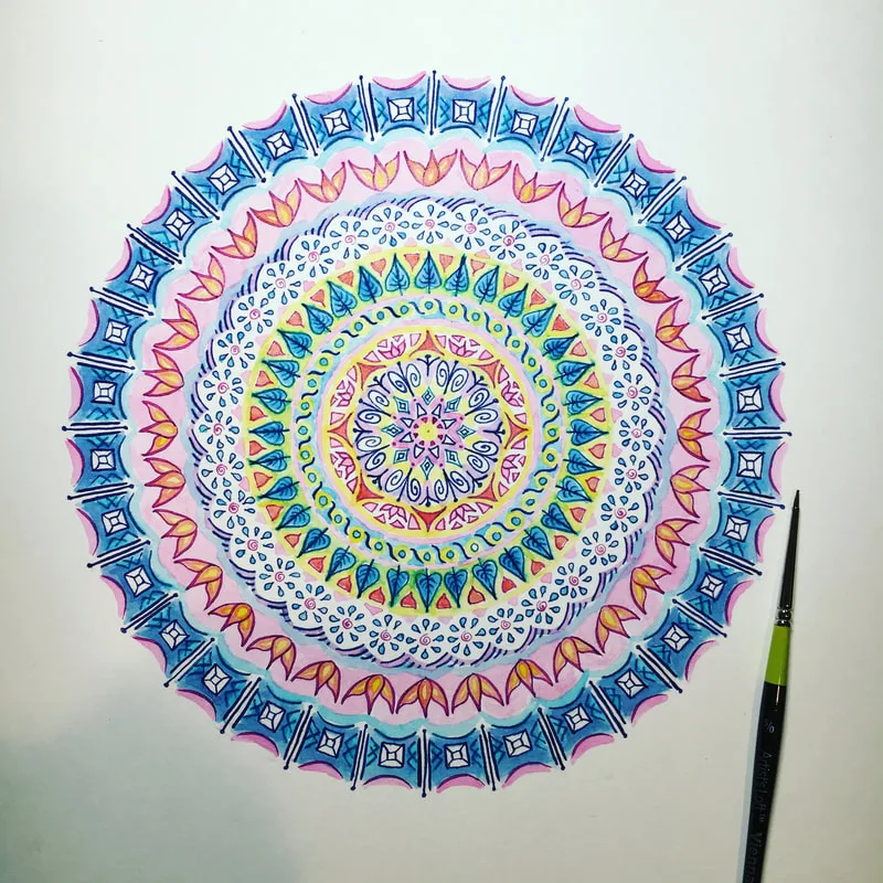hand drawn pen and ink mandala with flowers