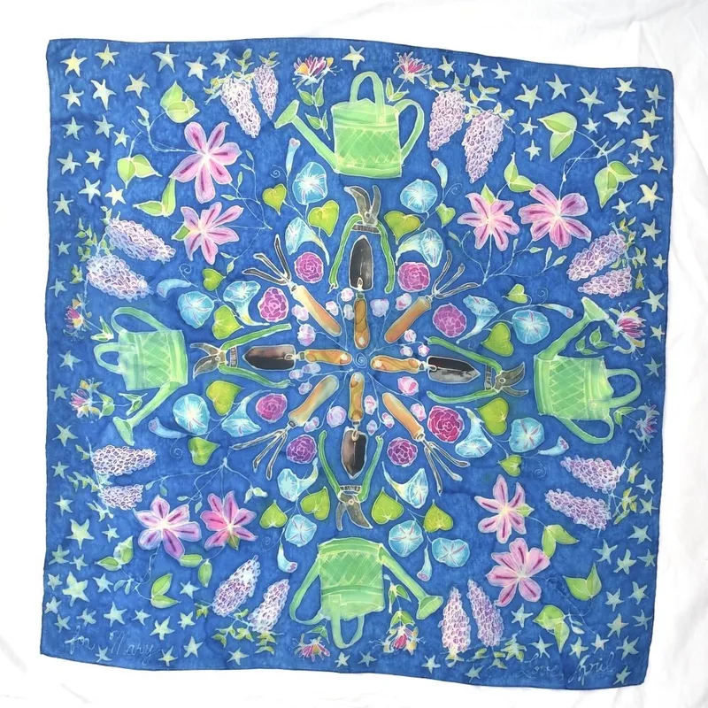 hand-painted silk scarf with garden theme, including vining flowers, watering can