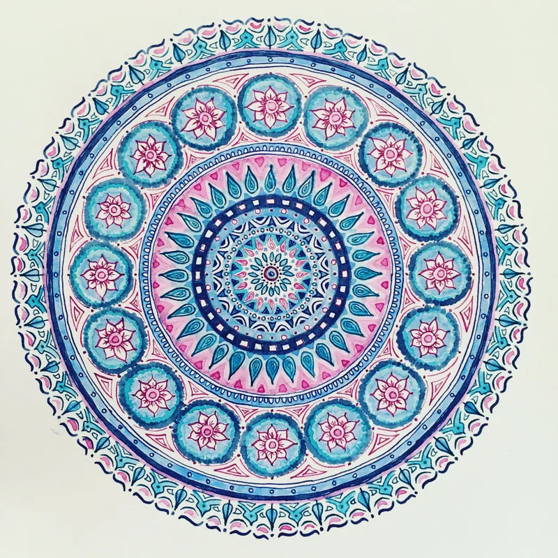 hand drawn pen and ink mandala with flowers