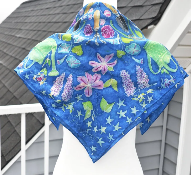 hand-painted mandala silk scarf with garden items, such as trowel, morning glory, sweet pea, rose, wisteria